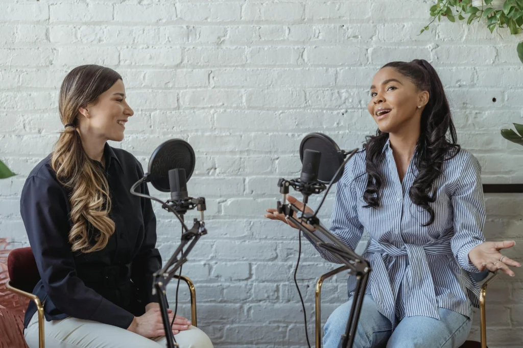 Amplify Your Reach: The Power of Podcast Marketing 2 podcast marketing
two women talking